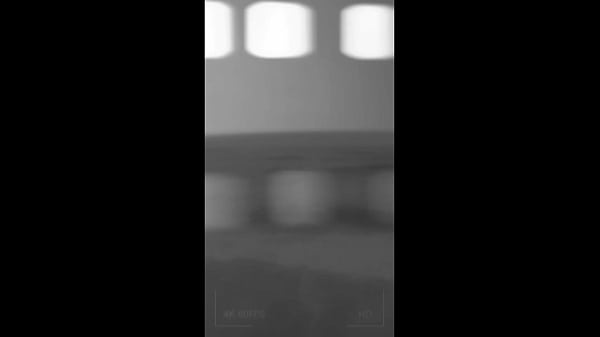 outdoor guy strips shirt and underwear by waterfall