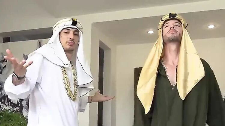 Two hot Arabs in headdress and robes bareback fuck